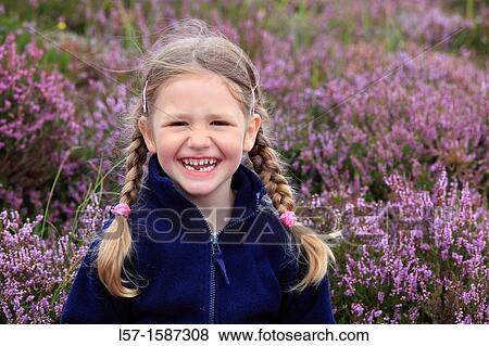 girl sitting in blooming heather field View Large Photo Image Stock Photo - girl sitting in blooming heather field. Fotosearch
