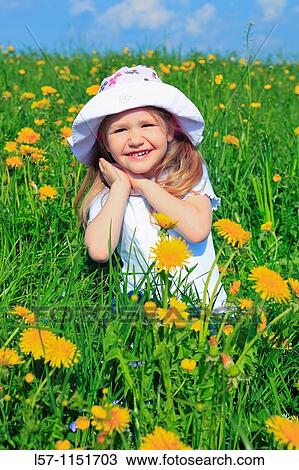 girl sitting in field of Dandelions, Zuercher Oberland, Zuerich, Switzerland View Large Photo Image Stock Image - girl sitting in field of Dandelions, Zuercher Oberland, Zuerich, Switzerland. Fotosearch
