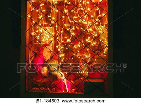 Girl sitting in Santa's lap, viewed through window View Large Photo Image Stock Image - Girl sitting in Santa's lap, viewed through window. Fotosearch