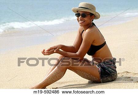 girl sitting on a beach View Large Photo Image Stock Photograph - girl sitting on a beach. Fotosearch