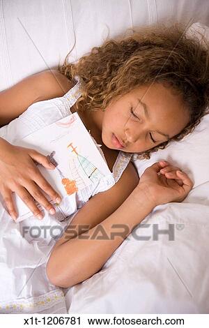 Stock Image - Girl sleeping.. Fotosearch