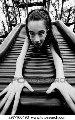 Girl sliding board. Carl Schurtz Park. New York City. USA View Large Photo Image Stock Image - Girl sliding board. Carl Schurtz Park. New York City. USA. Fotosearch