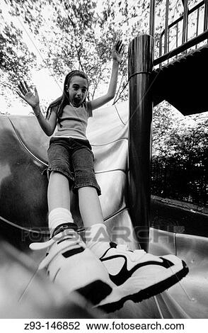 Girl sliding board. New York City. USA View Large Photo Image Stock Image - Girl sliding board. New York City. USA. Fotosearch