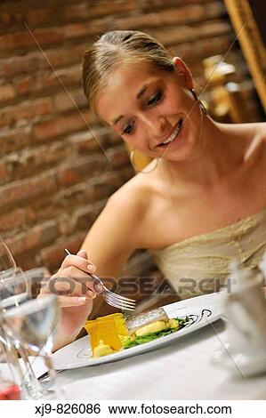 Girl smiling that meal in a restaurant View Large Photo Image Stock Photograph - Girl smiling that meal in a restaurant. Fotosearch