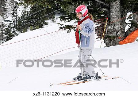 Stock Image - Girl snowboarding at the snow, Chica practicando snowboard en la nieve, Andorra, Europe. Fotosearch