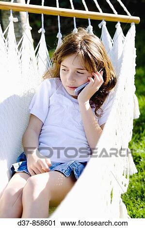Girl speaking with the mobile phone View Large Photo Image Stock Image - Girl speaking with the mobile phone. Fotosearch