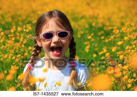 girl standing in blooming field View Large Photo Image Stock Photo - girl standing in blooming field. Fotosearch