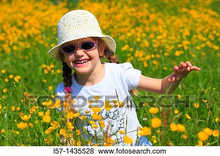 girl standing in blooming field View Large Photo Image Stock Photo - girl standing in blooming field. Fotosearch