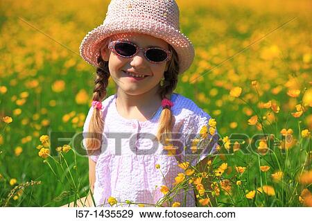 girl standing in blooming field View Large Photo Image Stock Photo - girl standing in blooming field. Fotosearch