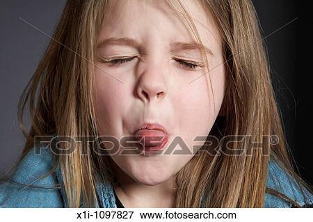 Girl sticking out tongue View Large Photo Image Stock Photo - Girl sticking out tongue. Fotosearch