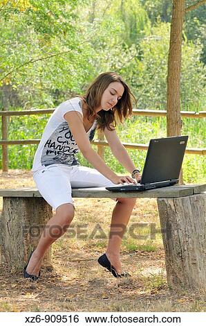 Stock Photograph - girl studying on campus. Fotosearch