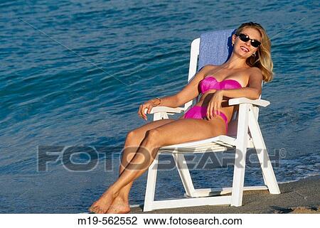 girl sunbathing at the beach View Large Photo Image Stock Image - girl sunbathing at the beach. Fotosearch