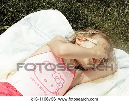 Girl sunbathing View Large Photo Image Stock Photograph - Girl sunbathing. Fotosearch