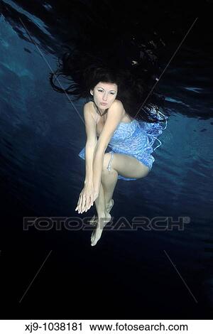 Stock Image - Girl swimming under the water fashion.. Fotosearch