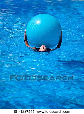 girl swimming with ball View Large Photo Image Stock Photography - girl swimming with ball. Fotosearch