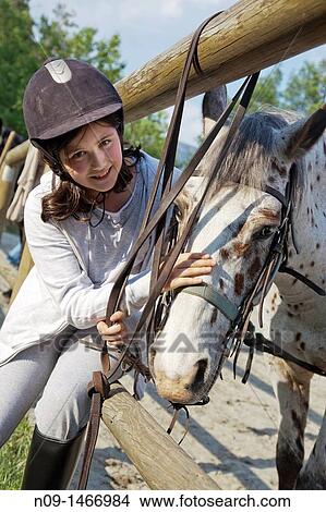 girl takes care of his horse View Large Photo Image Picture - girl takes care of his horse. Fotosearch
