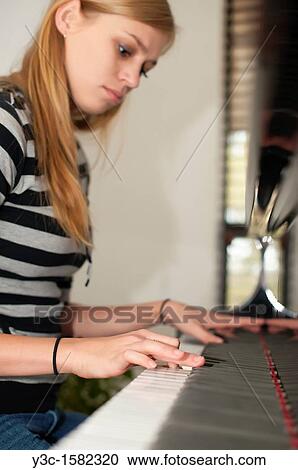 Girl taking piano lesson View Large Photo Image Stock Image - Girl taking piano lesson. Fotosearch