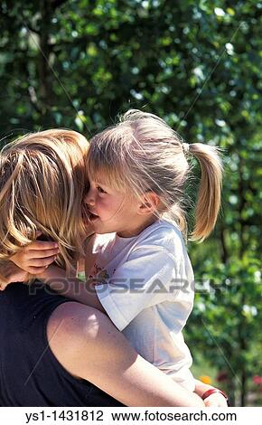 GIRL TELLING HER MUMMY A SECRET View Large Photo Image Stock Image - GIRL TELLING HER MUMMY A SECRET. Fotosearch
