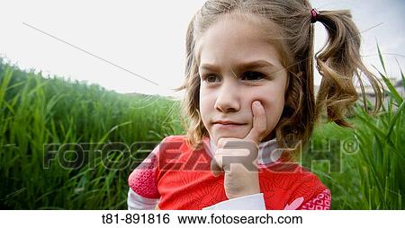 Stock Photograph - girl thinking, portrait. Fotosearch