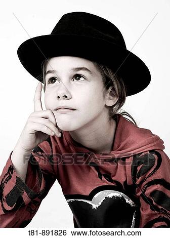 Stock Photograph - girl, thought a hat,. Fotosearch