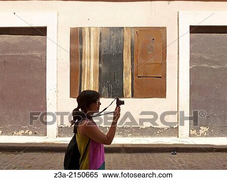 Girl tourist making pictures in the streets of Havana, Cuba. View Large Photo Image Stock Photography - Girl tourist making pictures in the streets of Havana, Cuba.. Fotosearch
