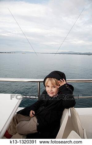 Girl traveling by boat View Large Photo Image Stock Image - Girl traveling by boat. Fotosearch