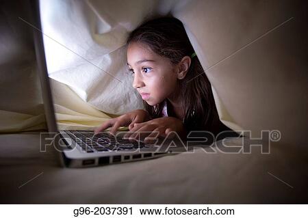 girl under the covers with a laptop. View Large Photo Image Stock Image - girl under the covers with a laptop.. Fotosearch