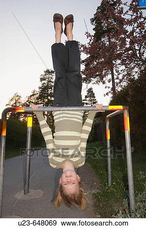 Stock Photo - Girl upside down.. Fotosearch