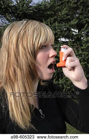 Girl using a bronchial dilator against symptoms of asthma View Large Photo Image Stock Image - Girl using a bronchial dilator against symptoms of asthma. Fotosearch