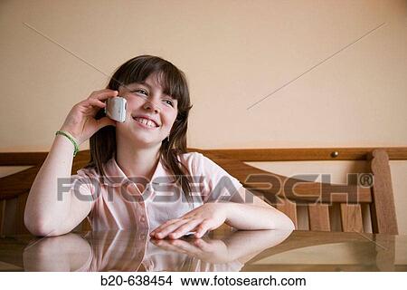 Girl using cell phone View Large Photo Image Picture - Girl using cell phone. Fotosearch