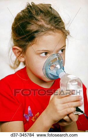 Picture - Girl using humidifier. Fotosearch