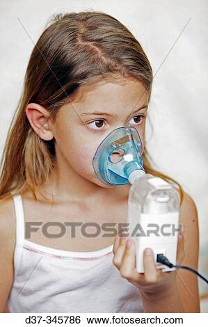 Girl using humidifier View Large Photo Image Stock Photograph - Girl using humidifier. Fotosearch