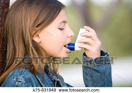Girl using inhaler View Large Photo Image Stock Photo - Girl using inhaler. Fotosearch