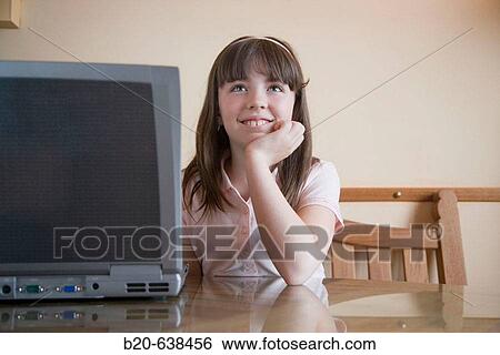 Stock Photograph - Girl using portable computer. Fotosearch