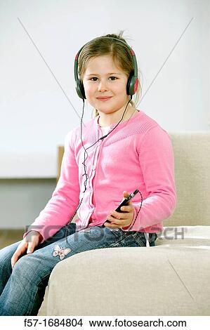 Picture - Girl using smartphone. Fotosearch