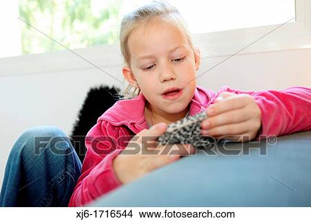 Picture - Girl using smartphone. Fotosearch