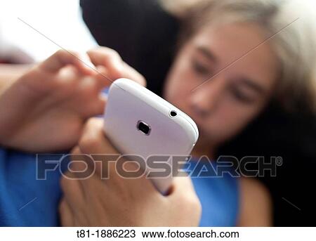 Girl using smartphone View Large Photo Image Stock Image - Girl using smartphone. Fotosearch