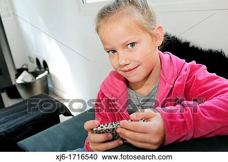 Girl using smartphone View Large Photo Image Stock Image - Girl using smartphone. Fotosearch