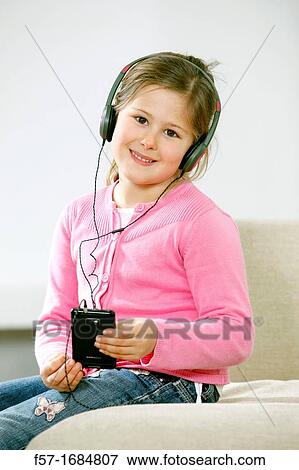 Stock Photo - Girl using smartphone. Fotosearch