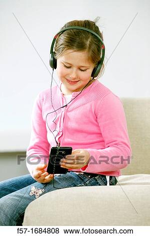 Girl using smartphone View Large Photo Image Stock Photo - Girl using smartphone. Fotosearch