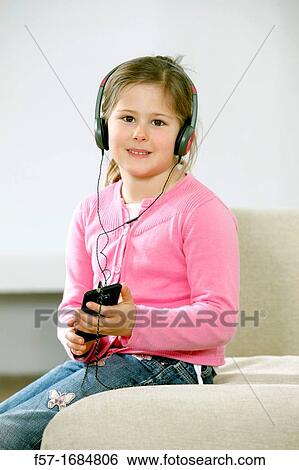 Stock Photograph - Girl using smartphone. Fotosearch