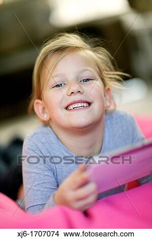 Girl using tablet computer View Large Photo Image Picture - Girl using tablet computer. Fotosearch