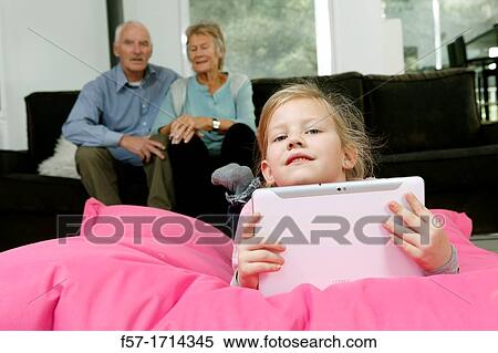 Stock Photography - Girl using tablet computer. Fotosearch