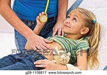 girl visiting doctor with teddy bear View Large Photo Image Stock Photo - girl visiting doctor with teddy bear. Fotosearch