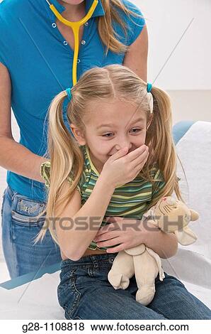girl visiting doctor with teddy bear View Large Photo Image Stock Photo - girl visiting doctor with teddy bear. Fotosearch