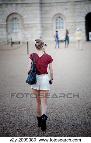 Stock Image - Girl walking in London.. Fotosearch