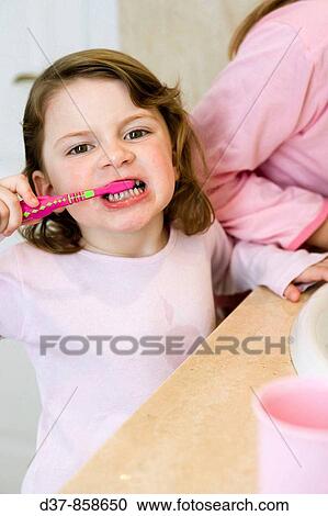 Girl washing teeth View Large Photo Image Stock Image - Girl washing teeth. Fotosearch