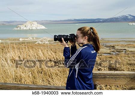 Girl with a camera at Mono Lake, California, USA View Large Photo Image Stock Image - Girl with a camera at Mono Lake, California, USA. Fotosearch