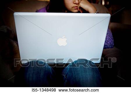 Stock Photo - Girl with a computer. Fotosearch