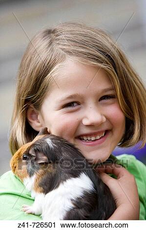 Girl with a guinea-pig View Large Photo Image Stock Image - Girl with a guinea-pig. Fotosearch